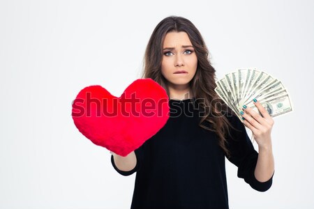 Woman choosing between love or money Stock photo © deandrobot