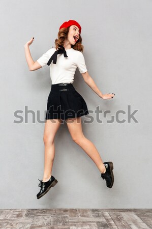 Charming woman in bodysuit posing with lollipop Stock photo © deandrobot