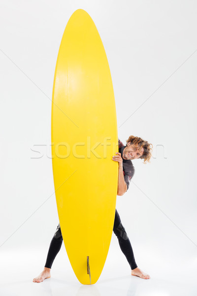 Gelukkig gekruld surfboard Stockfoto © deandrobot