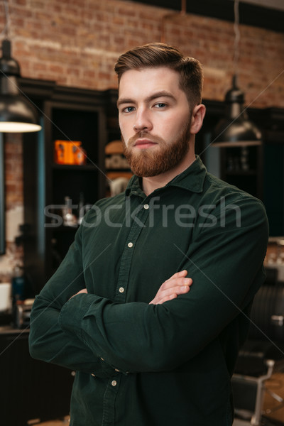 Man standing in barbershop and looking at camera. Stock photo © deandrobot