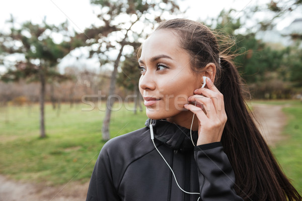 Young woman attractive runner in autumn park Stock photo © deandrobot