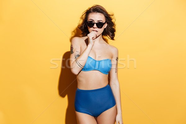 驚人 年輕女子 泳裝 照片 孤立 黃色 商業照片 © deandrobot