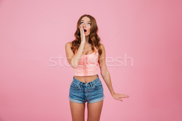 Portrait of a shocked surprised woman in summer clothes Stock photo © deandrobot