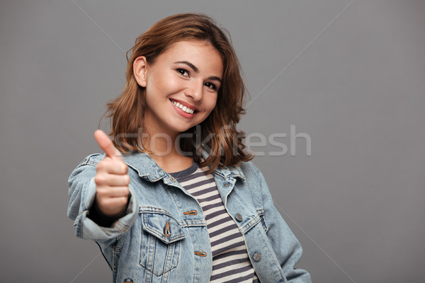 Close up portrait of a smiling pretty teenage girl Stock photo © deandrobot