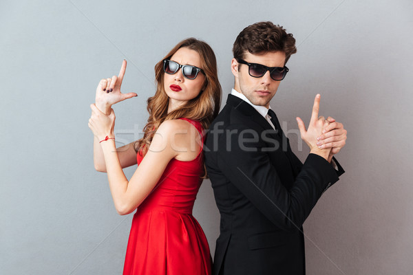 Portrait of a serious young couple dressed in formal wear Stock photo © deandrobot
