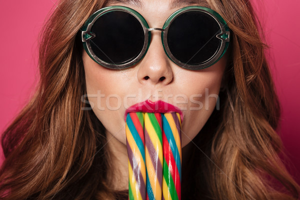 Close up portrait of a attractive young girl Stock photo © deandrobot