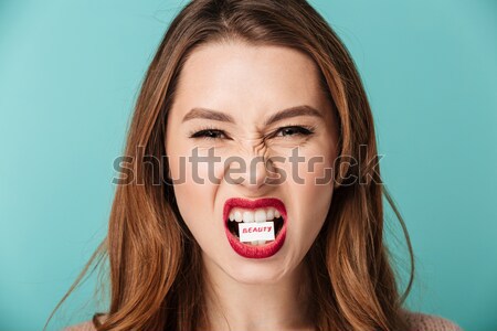 Portrait of a happy brown haired woman Stock photo © deandrobot