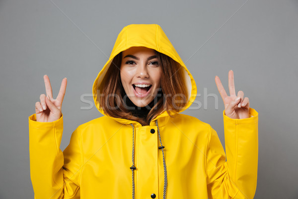 Portrait fille imperméable posant tête [[stock_photo]] © deandrobot