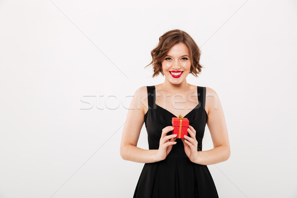 Portrait of a happy girl dressed in black dress Stock photo © deandrobot