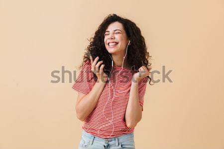 Portrait of a lovely young girl standing Stock photo © deandrobot