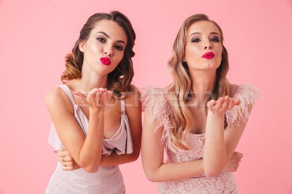 Two lovely women in dresses sends air kisses Stock photo © deandrobot
