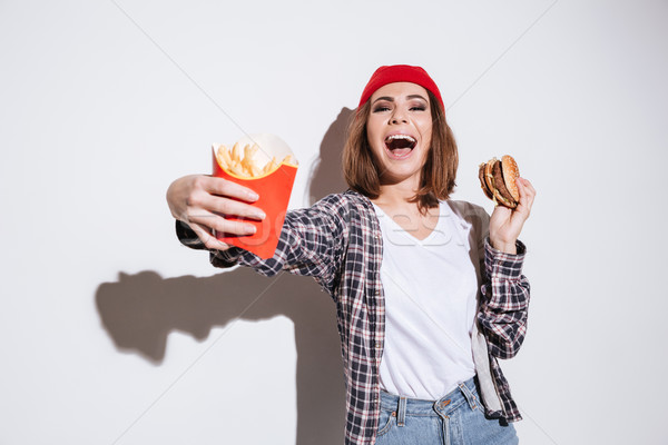 Stok fotoğraf: Kadın · patates · kızartması · Burger · aç
