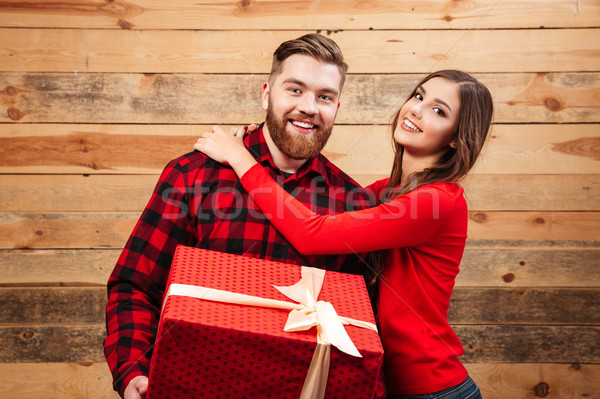 Man and woman with big gift Stock photo © deandrobot