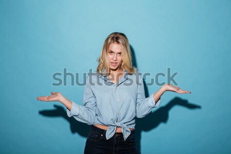 Vertical image of mystery woman in bathrobe holding book Stock photo © deandrobot