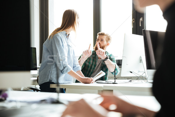 Colleagues in office talking with each other Stock photo © deandrobot