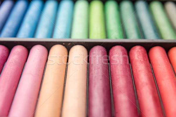 Close-up image of colorful chalk pastels in box Stock photo © deandrobot