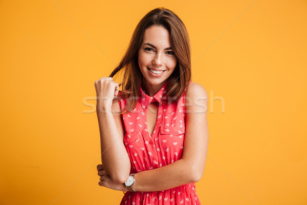 Close-up portrait of charming playful brunette woman, touching h Stock photo © deandrobot