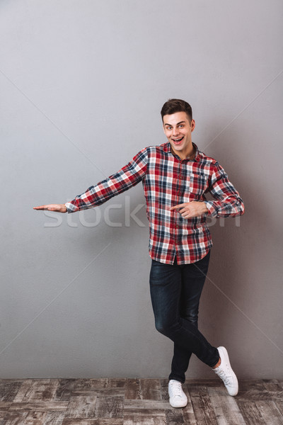 Obraz szczęśliwy człowiek shirt dżinsy Zdjęcia stock © deandrobot