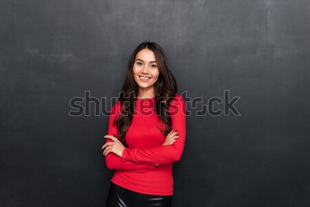 Higgadt barna hajú nő piros blúz karok Stock fotó © deandrobot