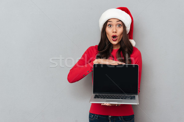 Conmocionado morena mujer rojo blusa Navidad Foto stock © deandrobot