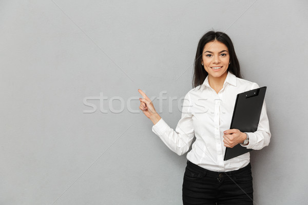 Portrait of office woman with long dark hair wearing white shirt Stock photo © deandrobot