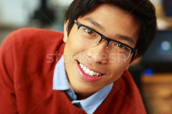 Stock photo: Closeup portrait of a Young happy asian man with glasses