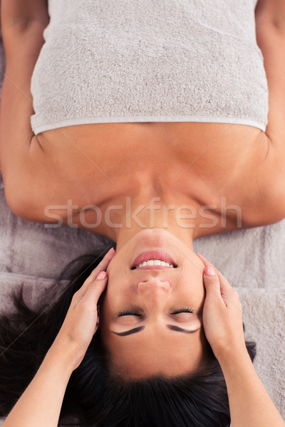 Woman having massage on her face Stock photo © deandrobot