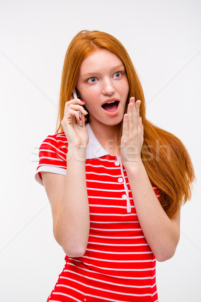 Maravilhado animado mulher falante telefone móvel Foto stock © deandrobot