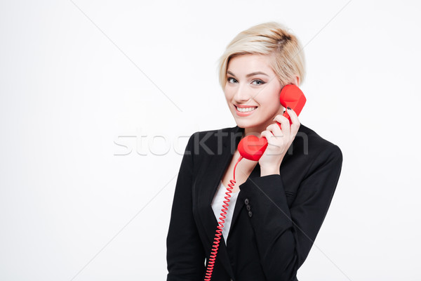 Smiling businesswoman talking on the phone tube Stock photo © deandrobot