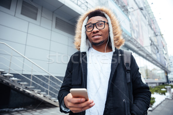 年輕 非洲的 男子 手機 手 商業照片 © deandrobot