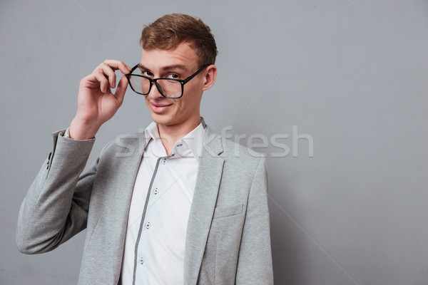 Man in suit and glasses Stock photo © deandrobot