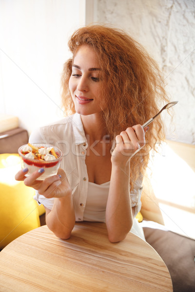 Heureux jeunes dame séance café [[stock_photo]] © deandrobot