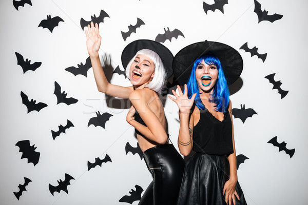 Stock photo: Emotional young women in halloween costumes