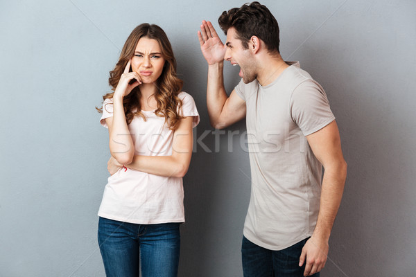 Retrato zangado furioso casal argumento cinza Foto stock © deandrobot