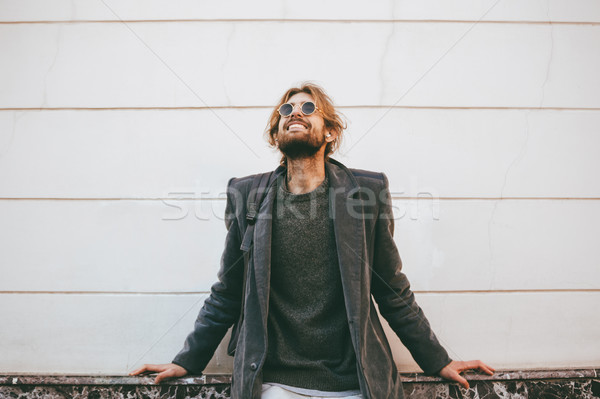 Retrato sorridente barbudo homem óculos de sol Foto stock © deandrobot