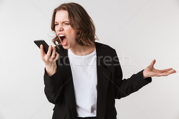 Krzyczeć młoda kobieta stałego odizolowany obraz mówić Zdjęcia stock © deandrobot