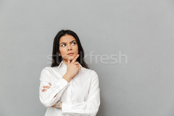 Portrait of serious office woman with long brown hair wearing fo Stock photo © deandrobot