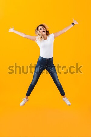 Funny man jumping over white background Stock photo © deandrobot
