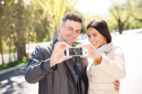 Stock photo: Happy couple making selfie photo