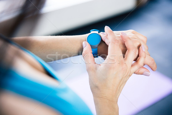 Woman with activity tracker Stock photo © deandrobot