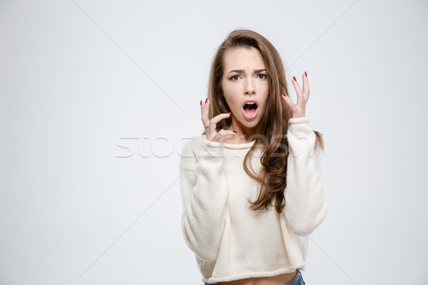 Scared woman looking at camera Stock photo © deandrobot