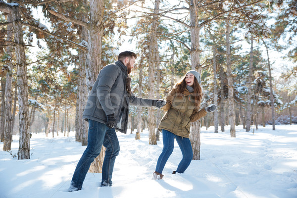 Couple walking in the winter park Stock photo © deandrobot