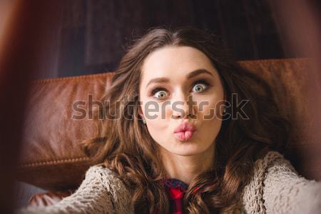 Tender young woman touching her face  Stock photo © deandrobot