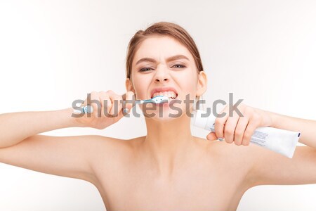 Bastante mulher jovem creme dental beleza retrato Foto stock © deandrobot