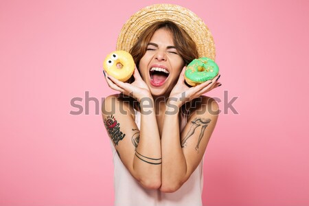 Closeup of happy funny young woman with marmalade candies  Stock photo © deandrobot