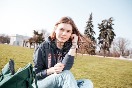 Nő fülhallgató zenét hallgat ír notebook mosolyog Stock fotó © deandrobot