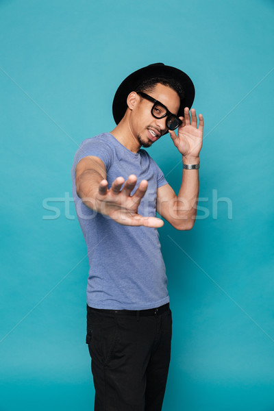 Stock photo: Young casual african man showing stop sign with hand