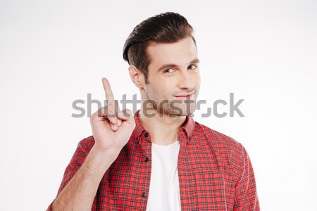 Man tonen wijsvinger shirt naar camera Stockfoto © deandrobot