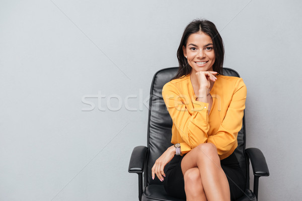 Portrait satisfait souriant femme d'affaires séance président [[stock_photo]] © deandrobot