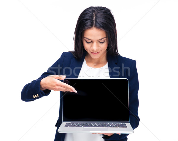 Happy businesswoman pointing on the blank laptop screen Stock photo © deandrobot